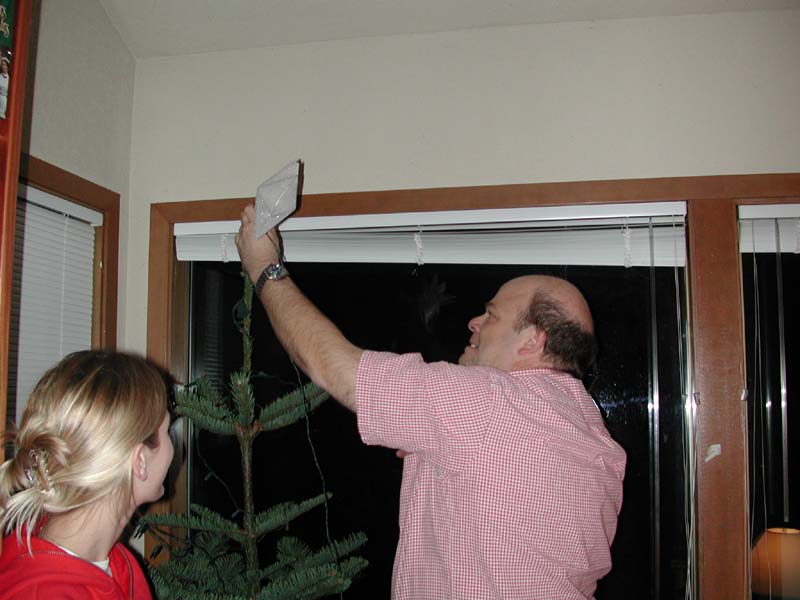 Bryan decorating tree.jpg 59.1K